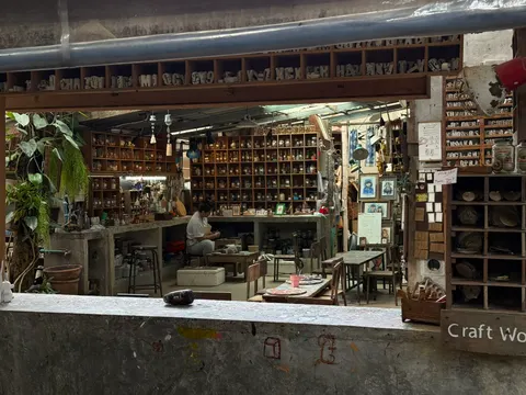 Handmade crafts fill a wooden open-air shop in Chiang Mai.